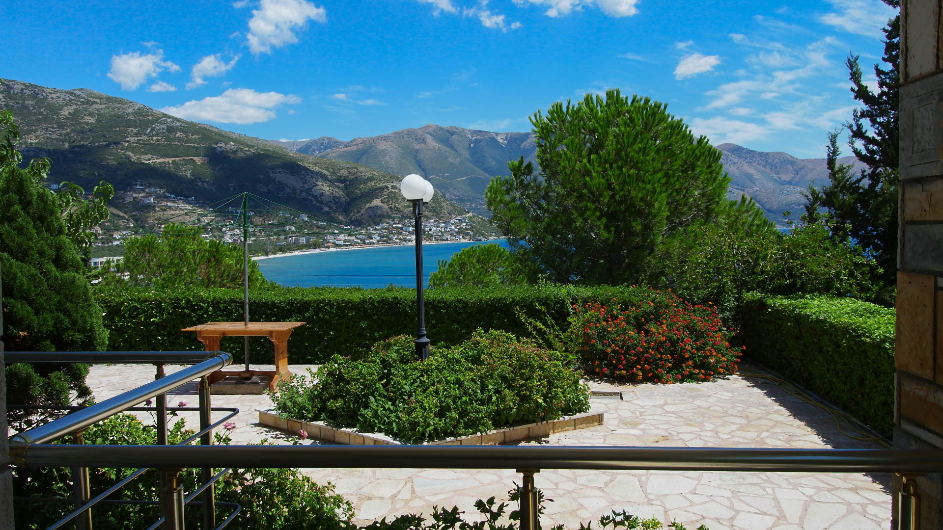 View of the yard, the trees and the sea in Qeparo from the balcony.